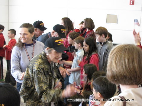 World War II veteran greeting passengers at Washington Dulles Airport